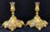 Pair of antique carved bronze candlesticks.