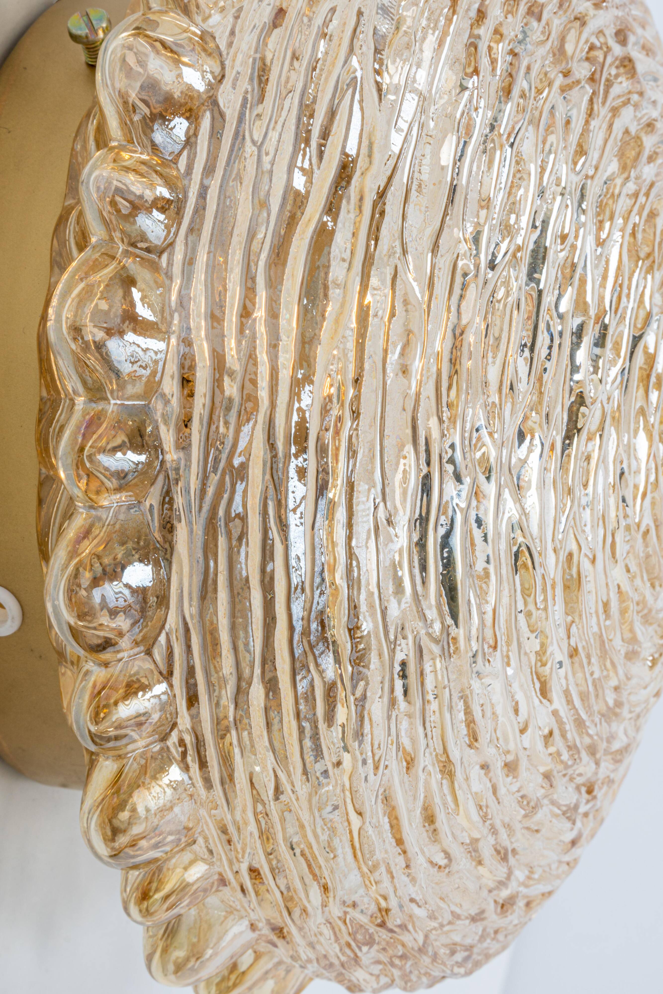 Amber glass wall sconces in the shape of a fingerprint, Germany, 1970s.