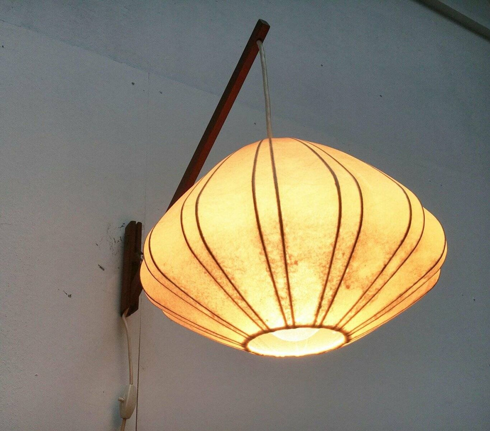 Mid-century pivoting wall lamp with a swing arm, Cocoon, made of teak wood, 1960s.