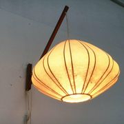 Mid-century pivoting wall lamp with a swing arm, Cocoon, made of teak wood, 1960s.