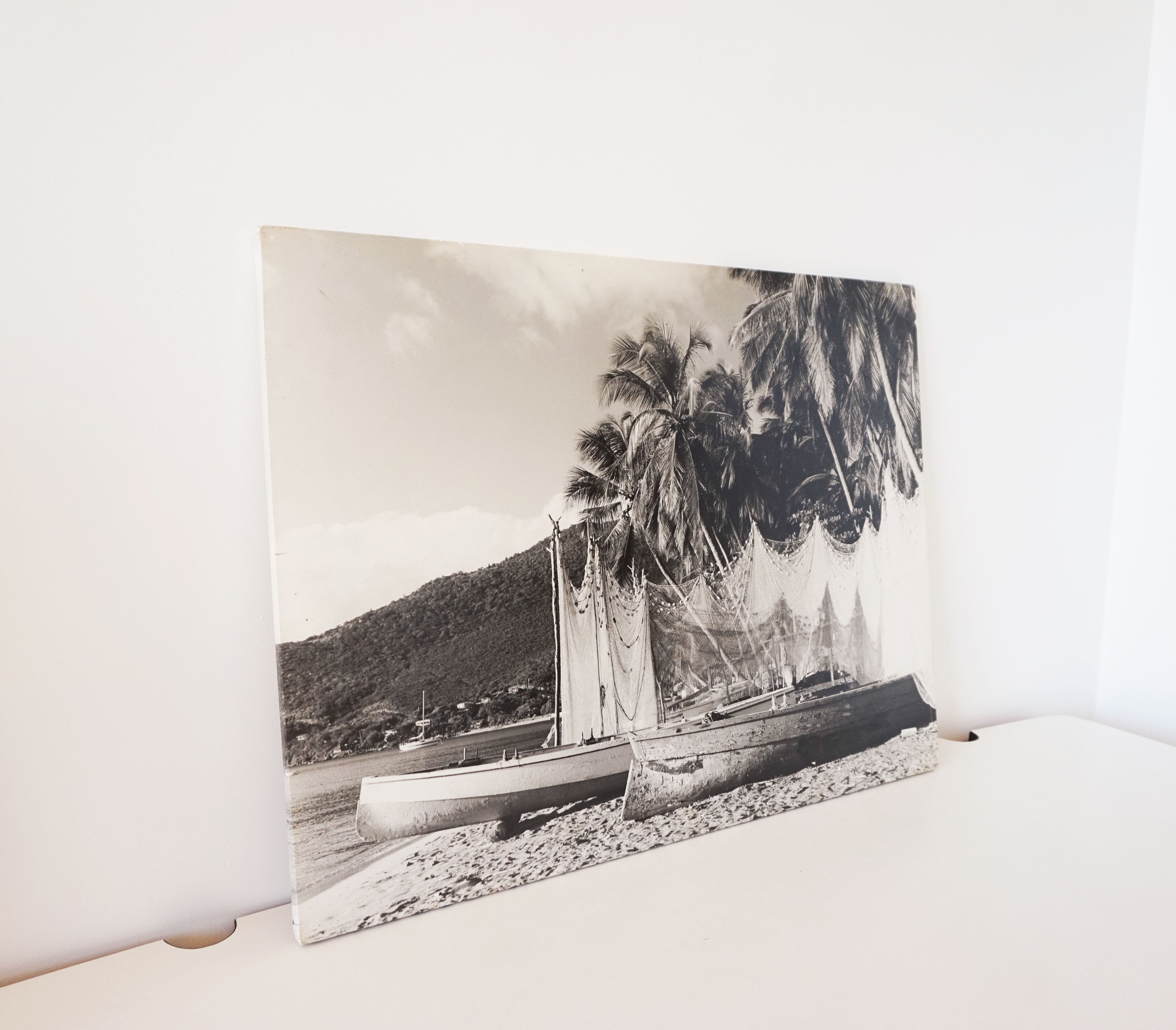 Old photograph on wood panel