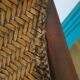 Woven rattan armchair and exotic wood in colonial style, 1980s.