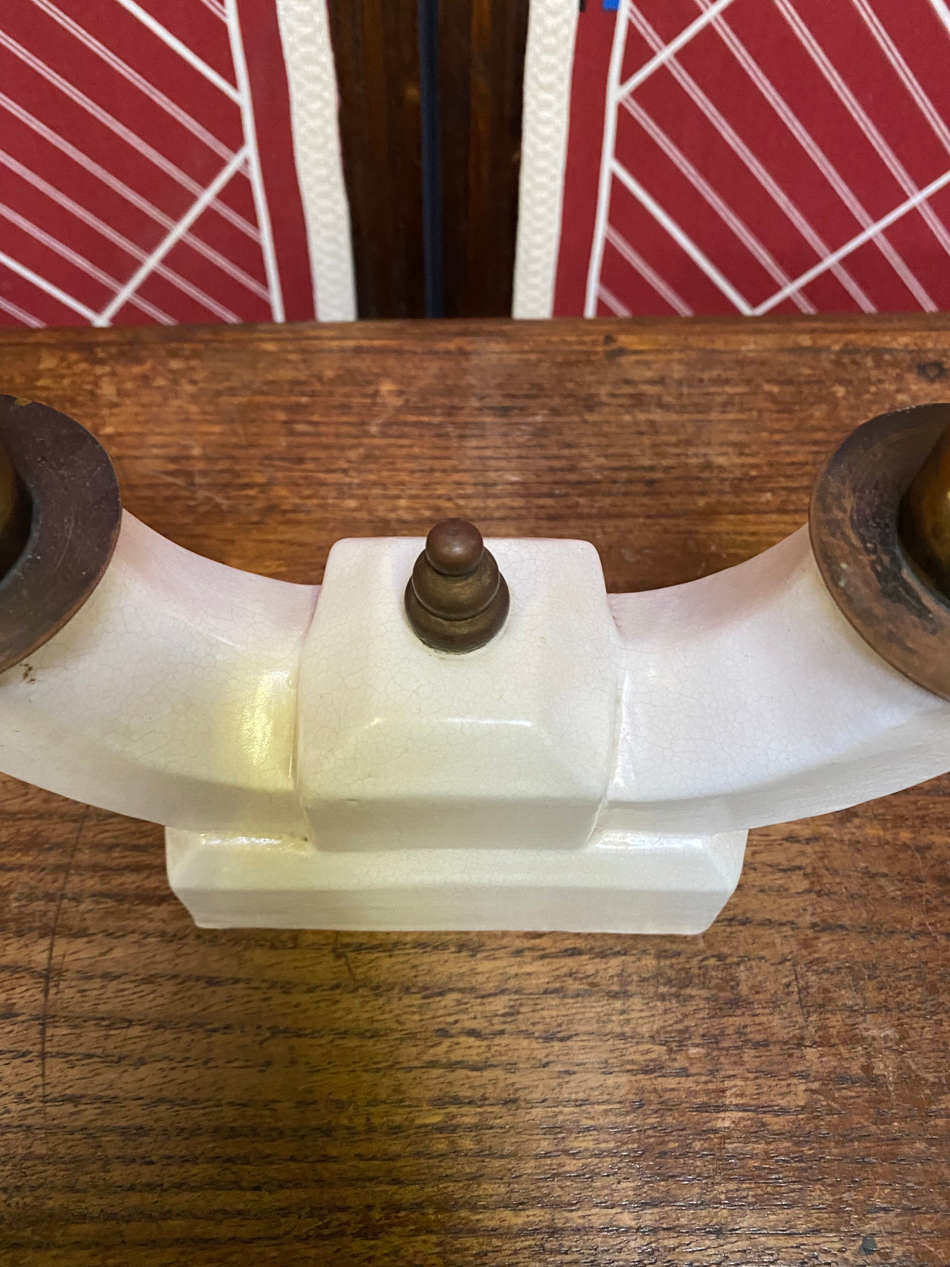Pair of ceramic and brass office chandeliers