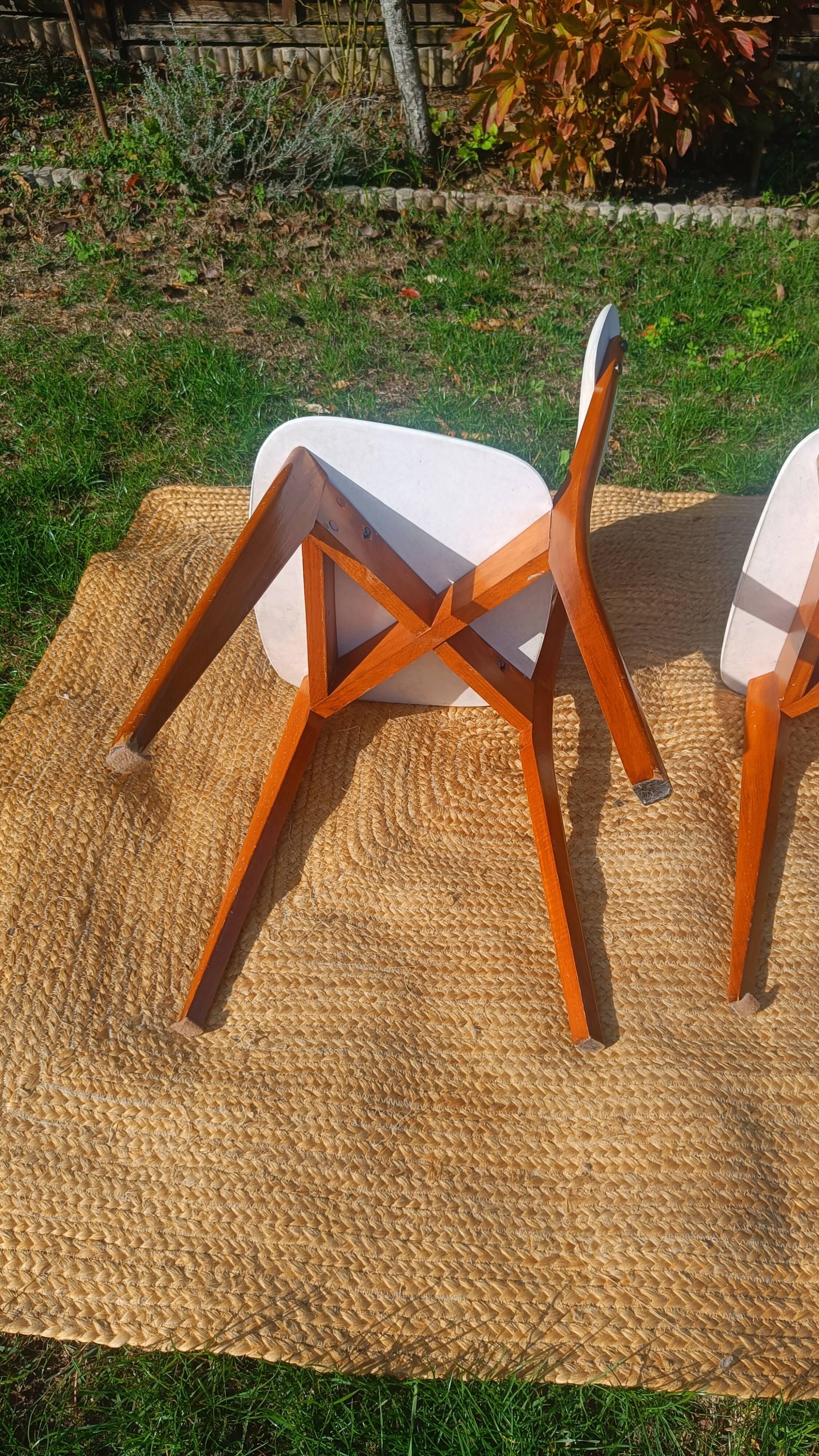 vintage wooden chairs with white faux leather