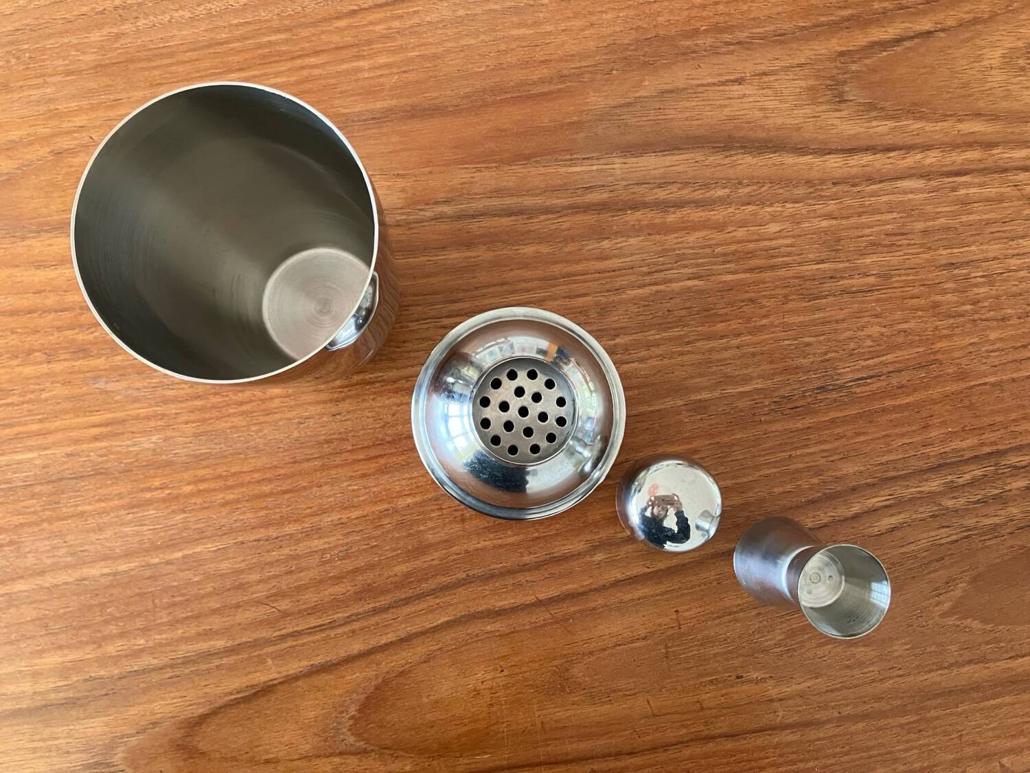 Shaker and five cocktail glasses