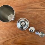 Shaker and five cocktail glasses