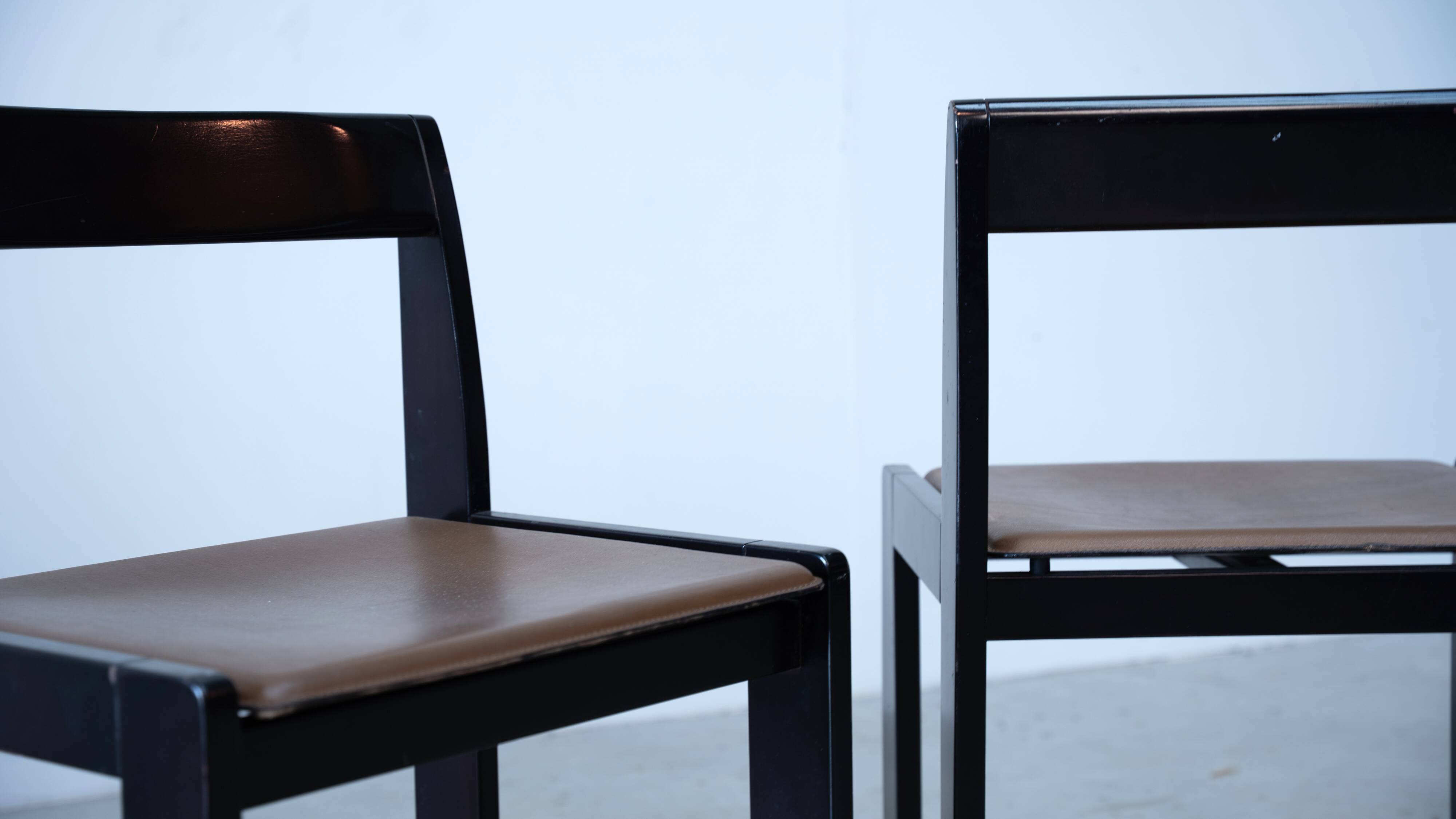 Set of eight black lacquered dining chairs