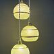 Suspension triple vintage glass globes in frosted green and gold.