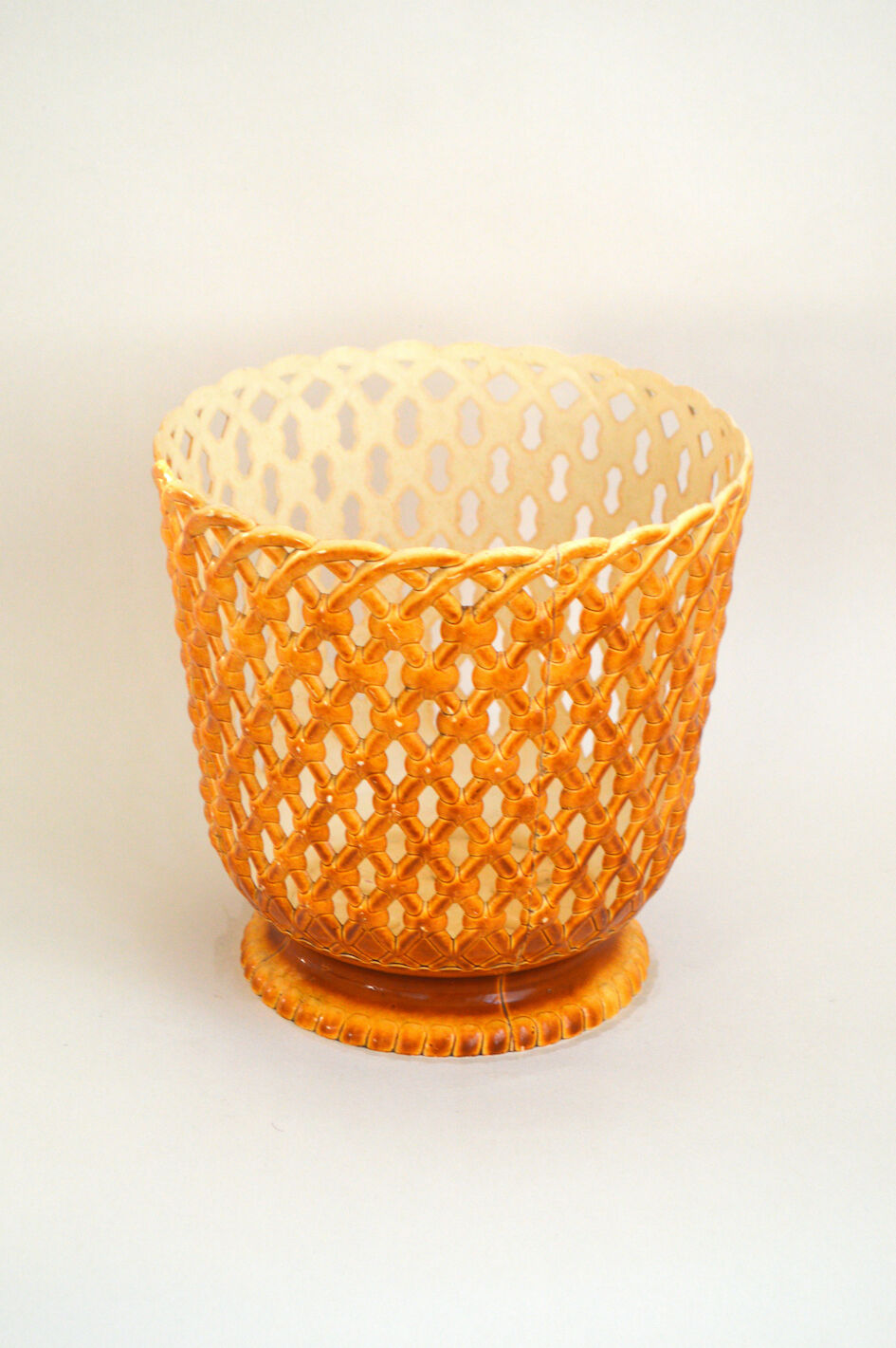 Orange openwork pot cover