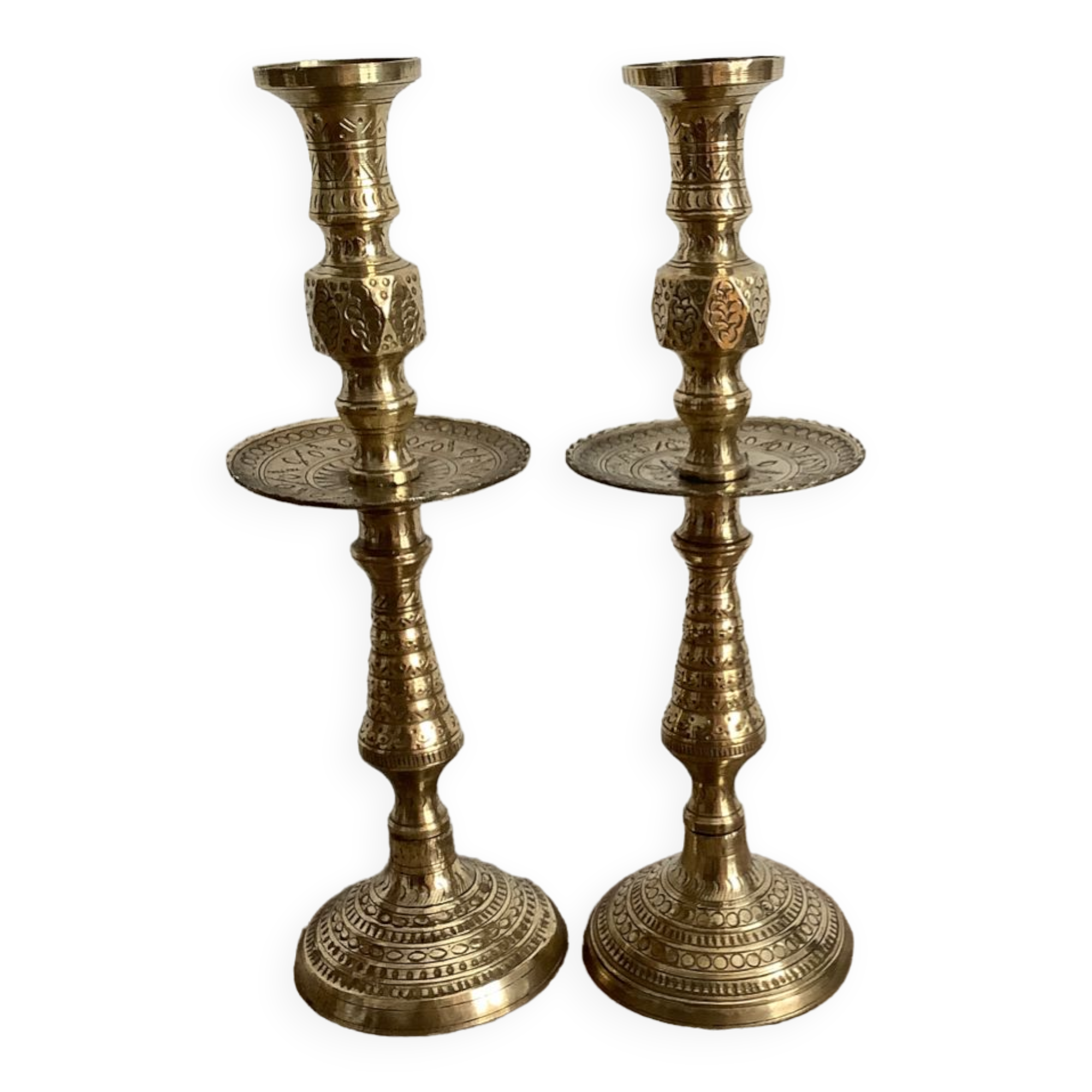 Pair of engraved brass candle holders