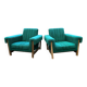 Duo de fauteuils vintage à tissus vert.