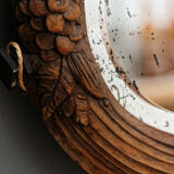 Beveled mirror in carved wood