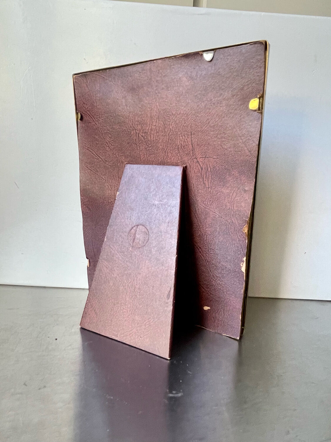 Metal frame in gold colored brass