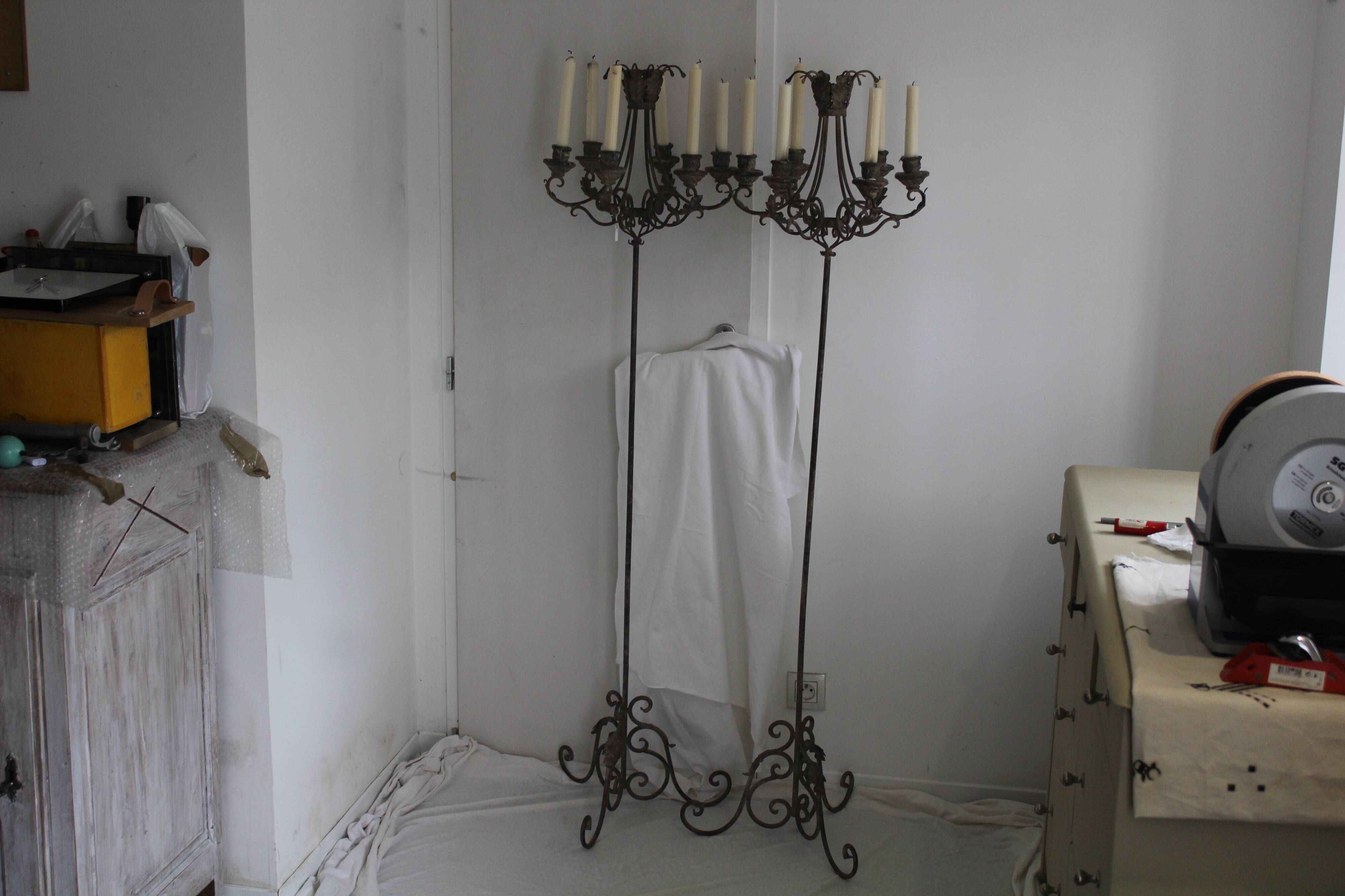 Candles on feet,  candelabras