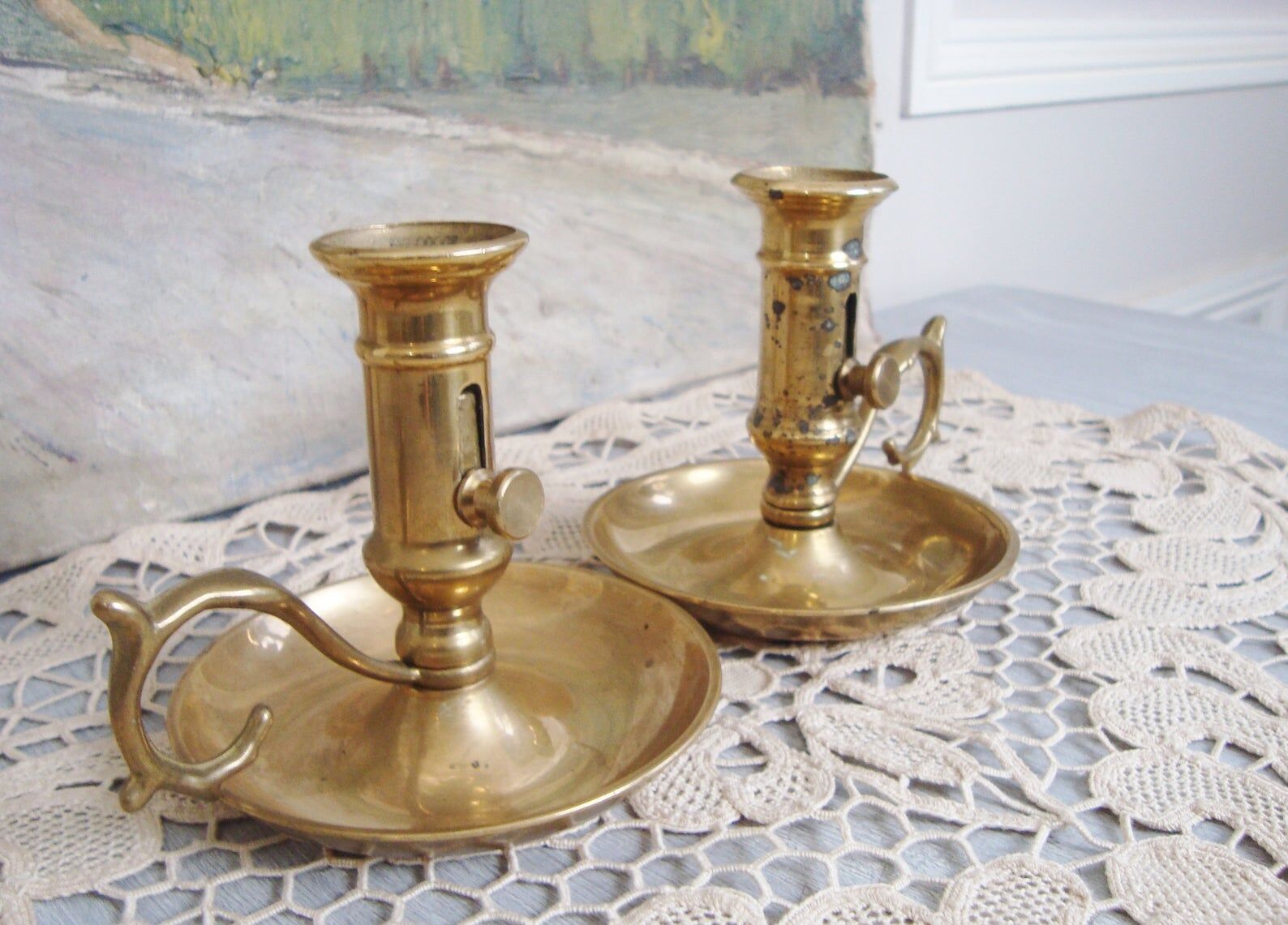 Pair of brass cellar rat candlesticks