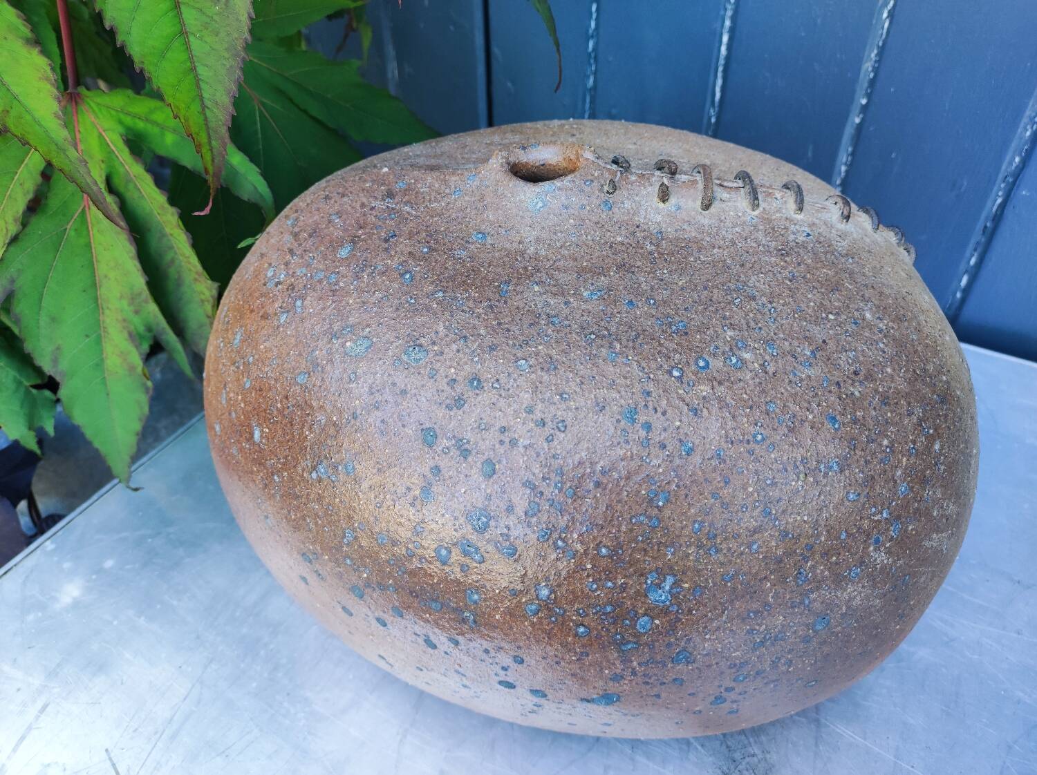 Vintage sandstone vase, in the shape of a rugby ball, signed