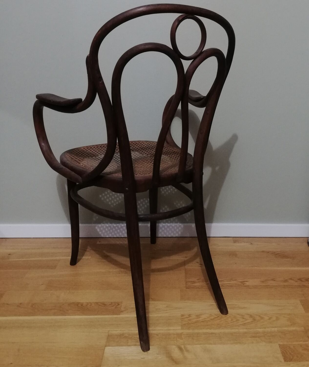 Canned armchair in curved wood signed J.Kohn
