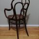 Canned armchair in curved wood signed J.Kohn