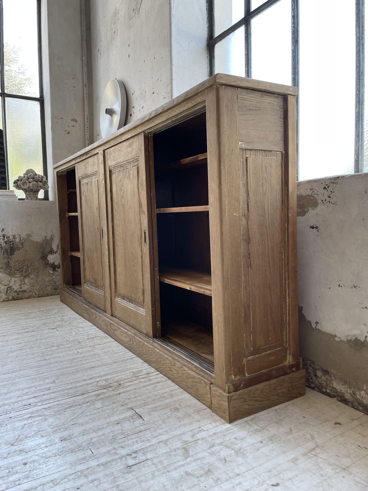 Large row of solid oak loom sliding doors