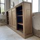 Large row of solid oak loom sliding doors