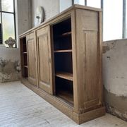 Large row of solid oak loom sliding doors