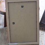 Rectangular gold mirror with moulded decoration.