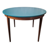 Extendable oval teak dining table