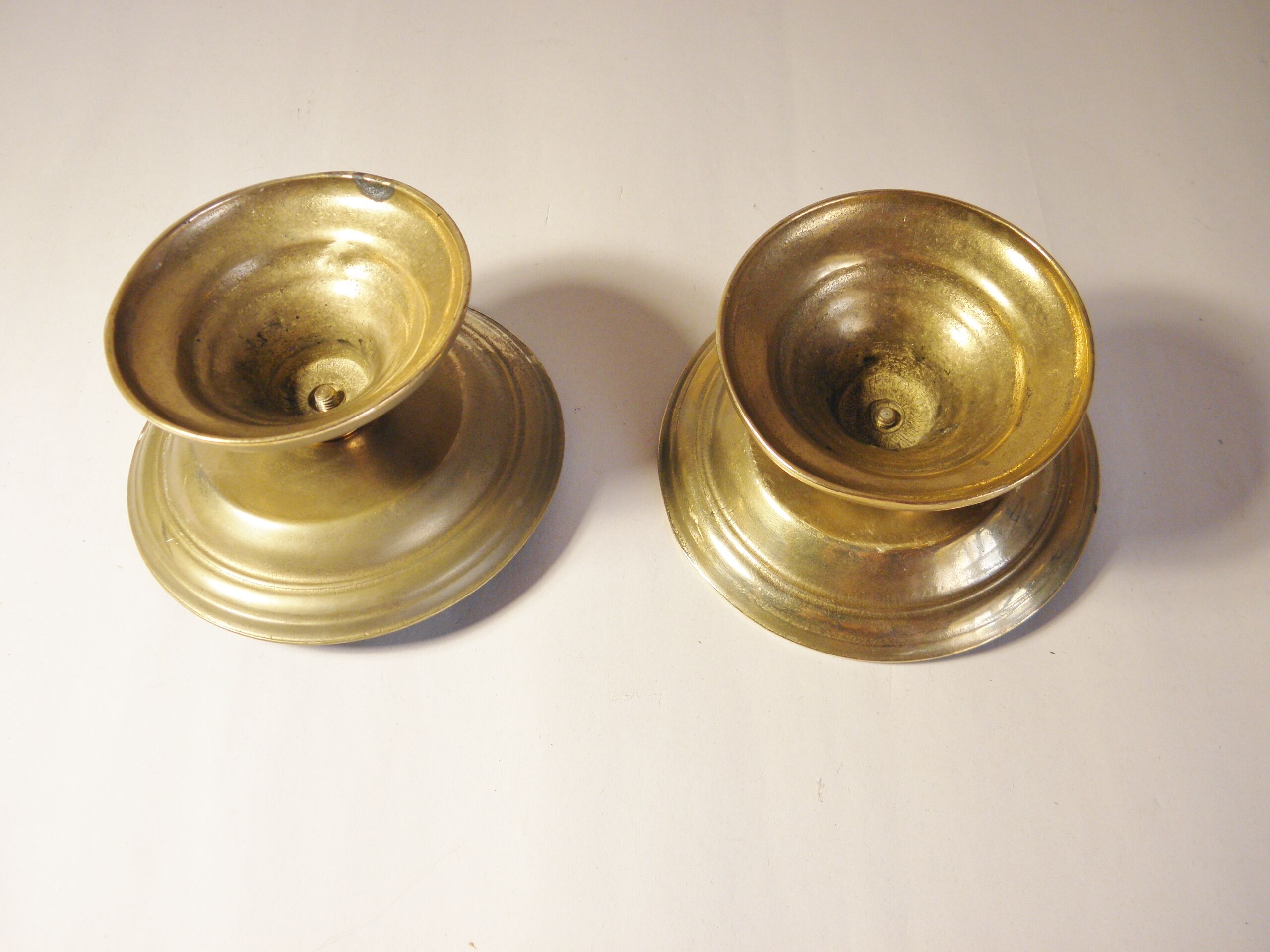 Pair of golden brass candlesticks
