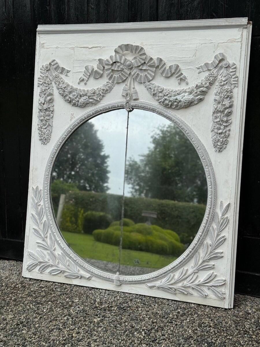 Louis XVI style fireplace mirror, carved wood trumeau with white and grey highlights, 18th century