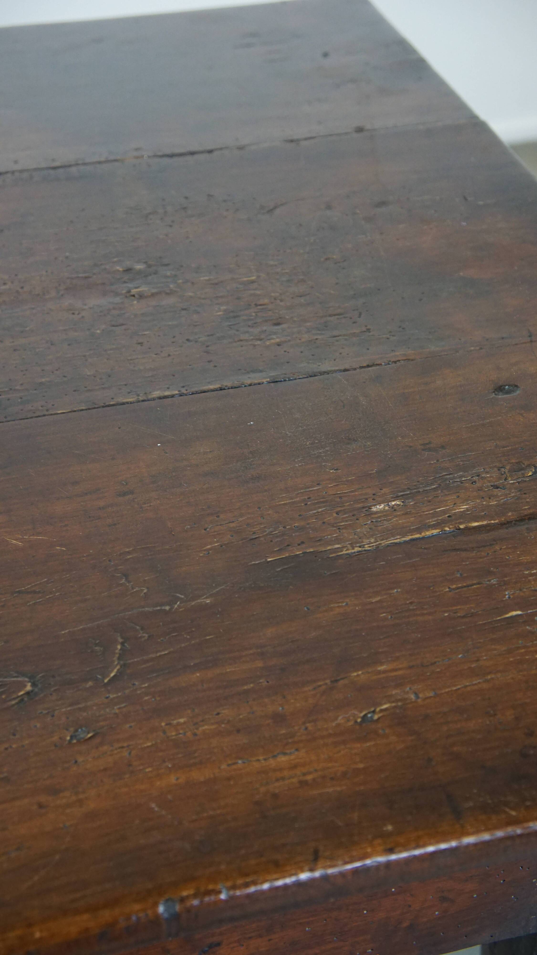 Antique French fruitwood dining table with 2 drawers and patina