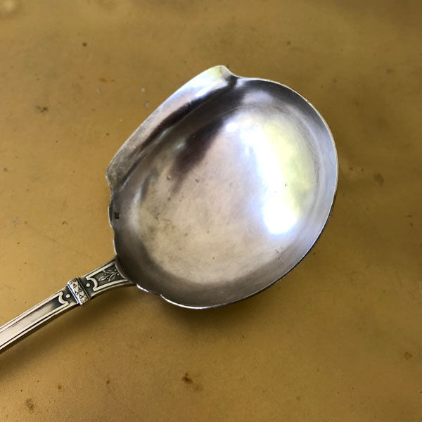 Silver metal ladle