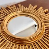 Old large golden sun mirror with rounded witch's eye in vintage resin from the 70s