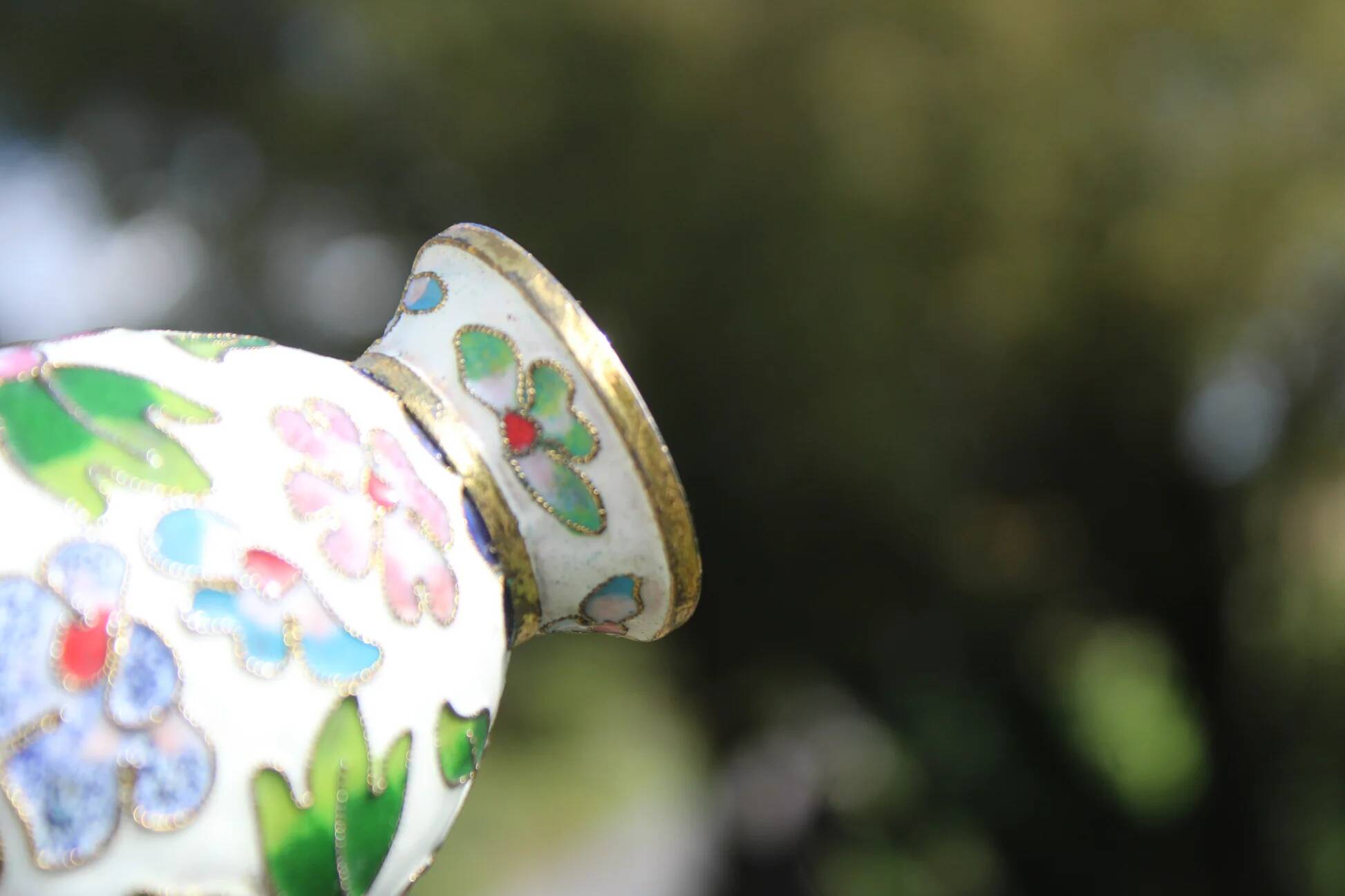Two small vintage cloisonné enamel vases with Asian floral decoration.
