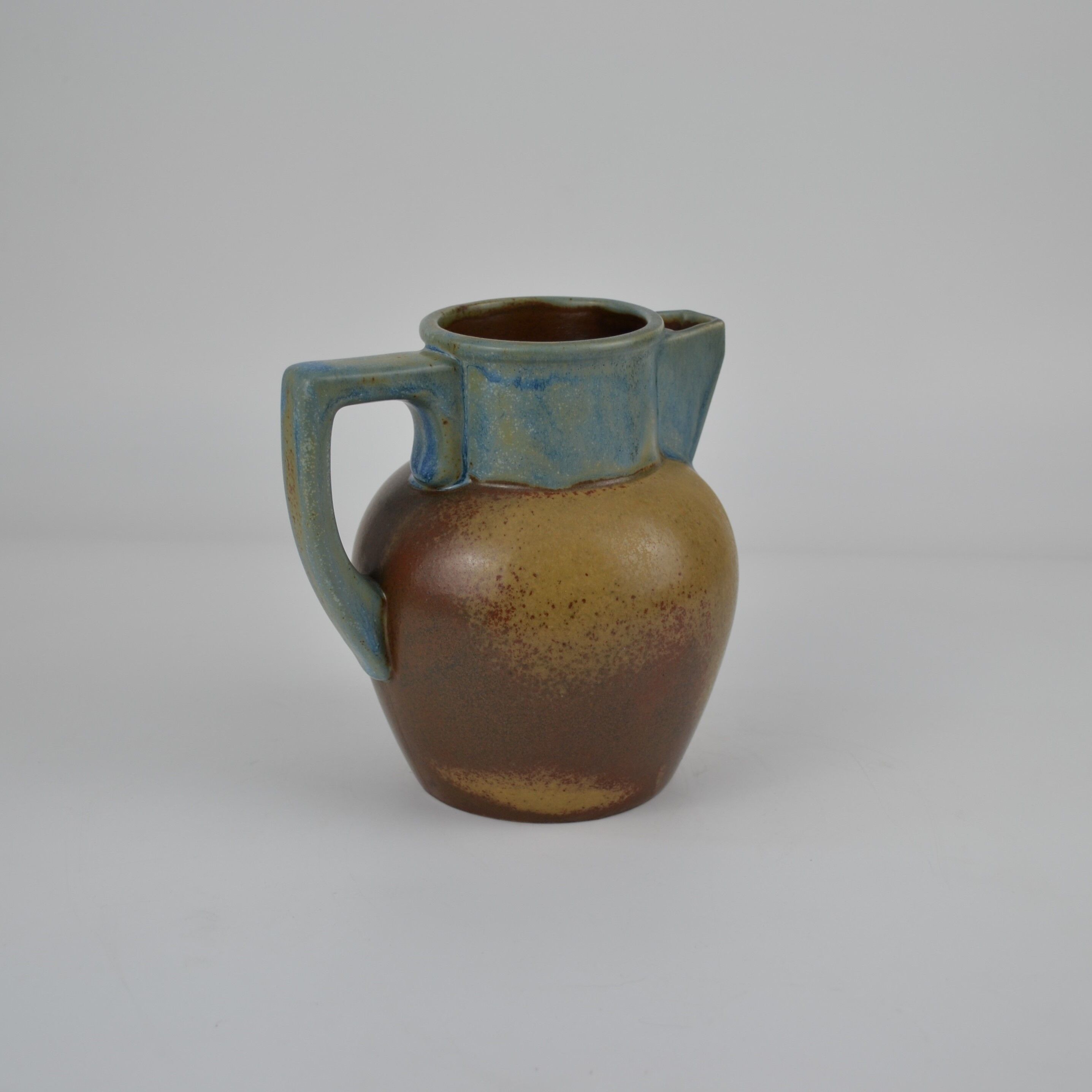Two-tone stoneware pitcher by Louis Lourioux