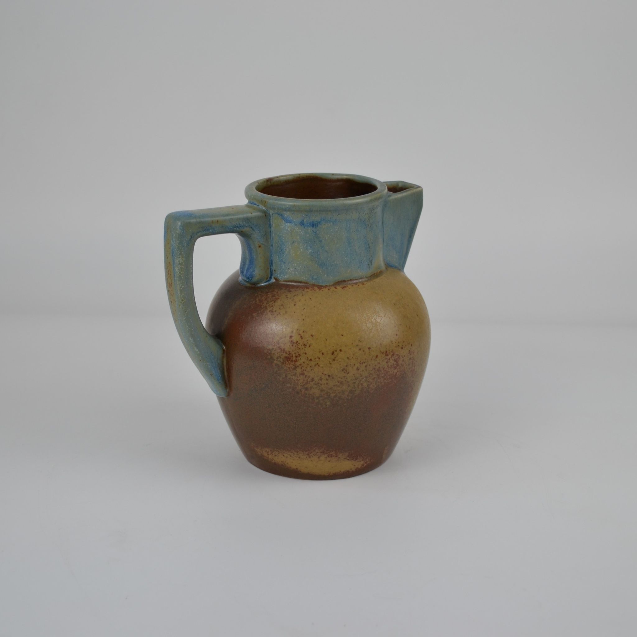 Two-tone stoneware pitcher by Louis Lourioux