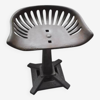 Singer cast iron stool.