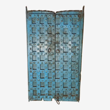 Porte ancienne bleue en bois avec croisillons