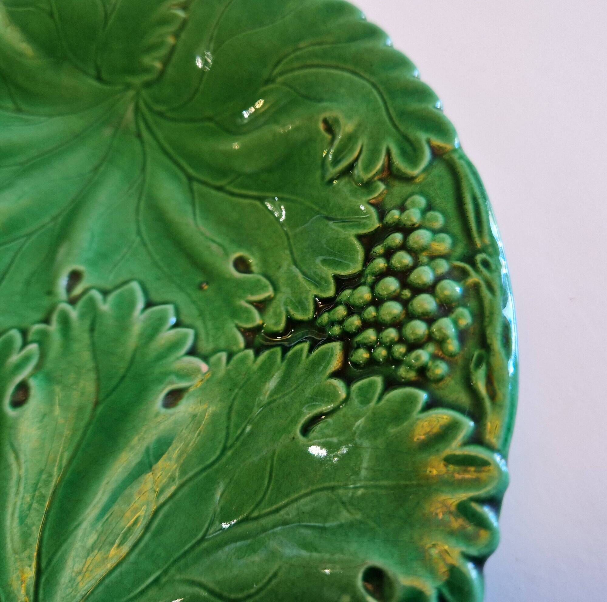 8 green barbotine plates from the early 20th century.