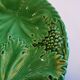 8 green barbotine plates from the early 20th century.