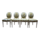Suite de 4 chaises médaillons de style Louis XVI rechampi blanc cassé