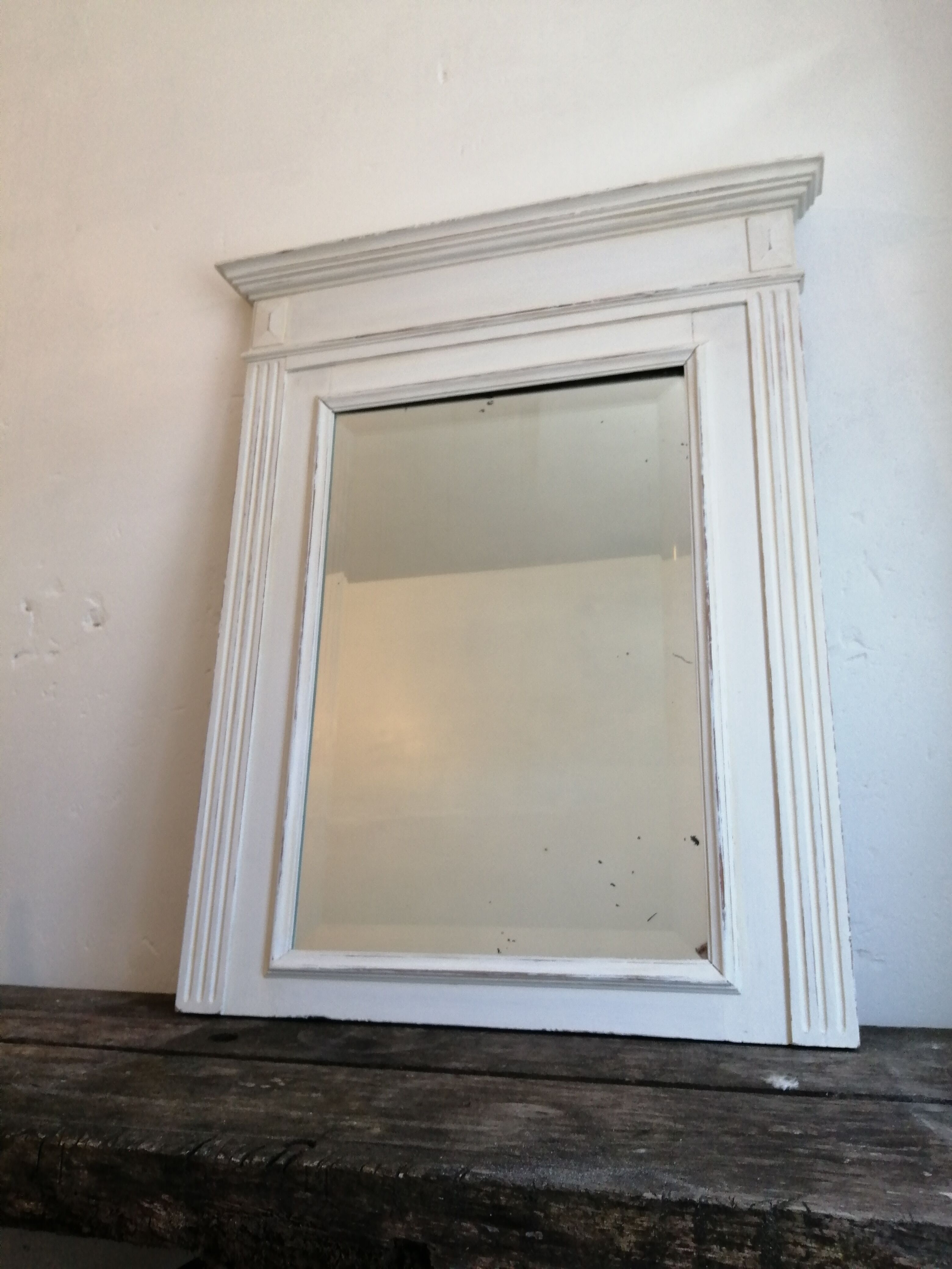 Beveled fireplace mirror
