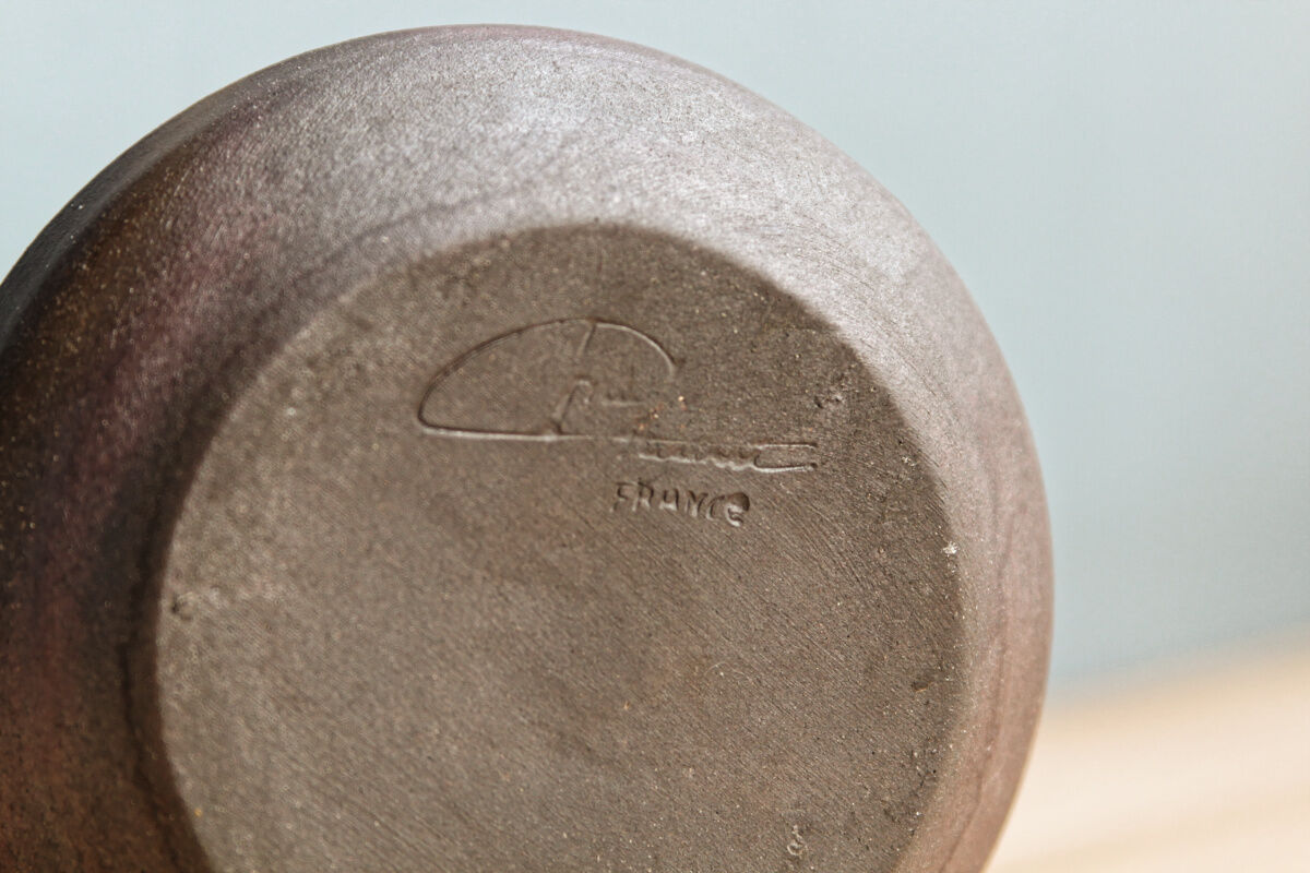 Small hand-held candlestick, signed