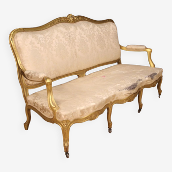 French golden sofa in Louis XV style from 20th century