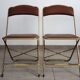 2 golden metal chairs with faux leather in the 60s/70s Opera style.