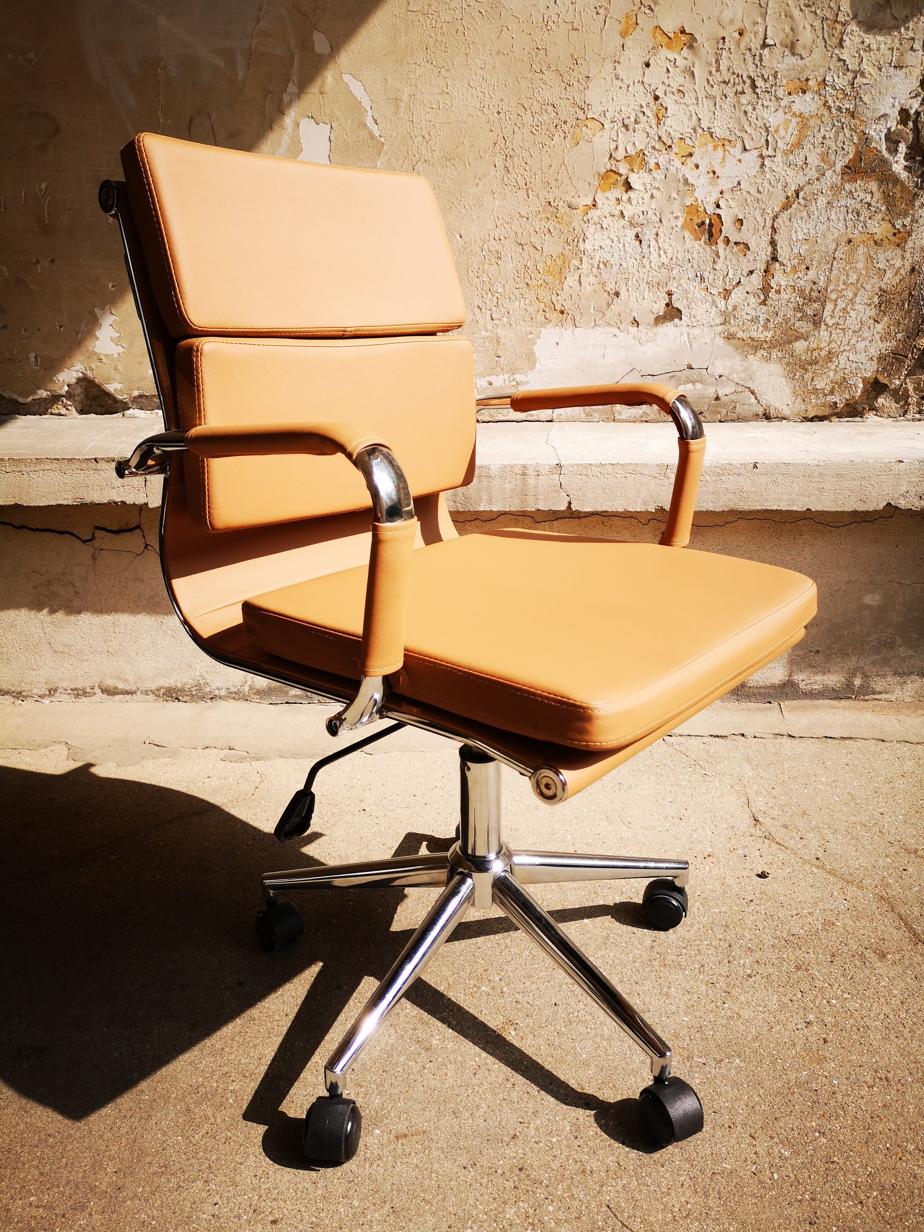 Light brown faux-leather office armchair