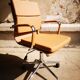 Light brown faux-leather office armchair
