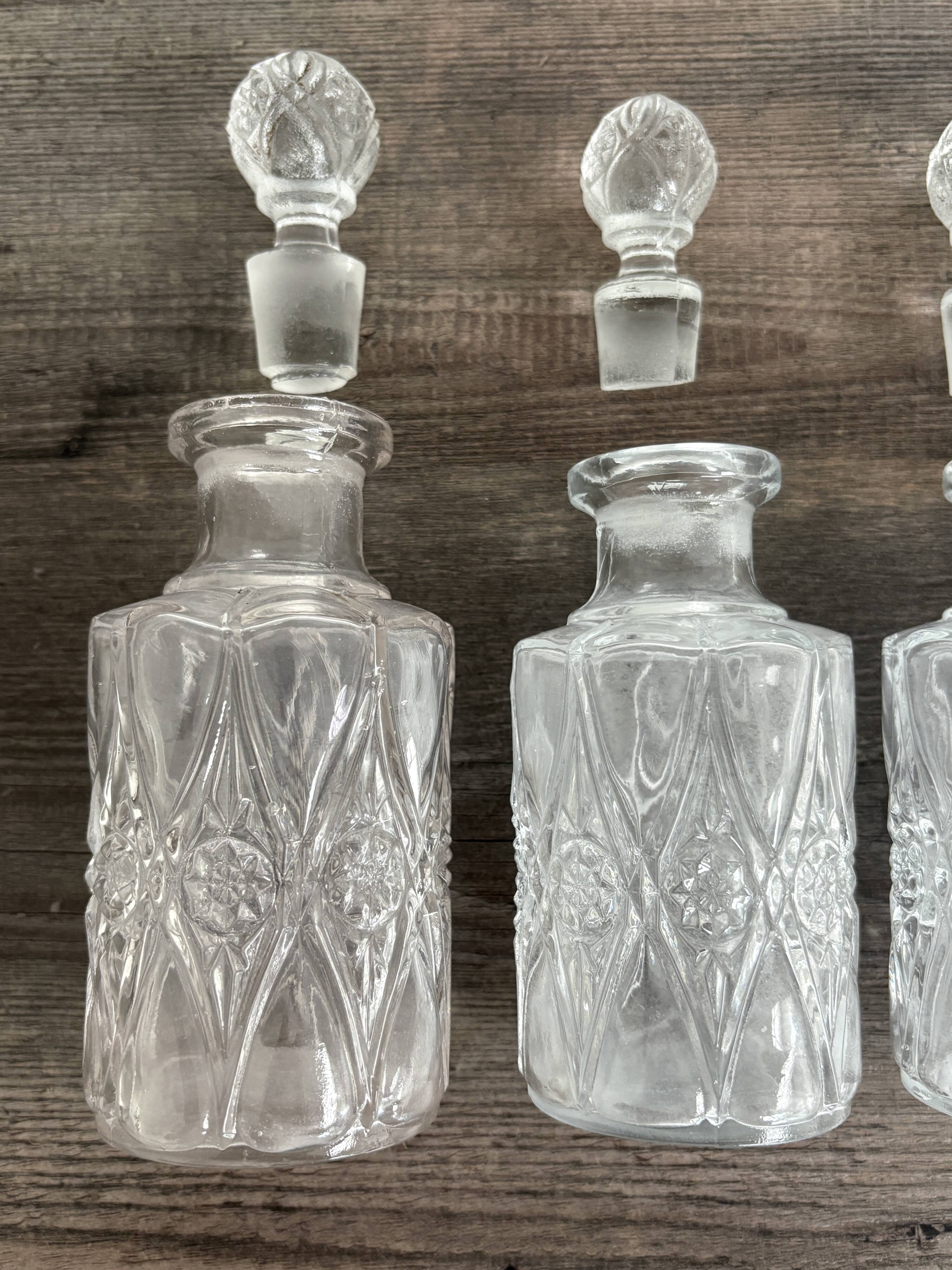 Set of 4 molded crystal bottles – Val Saint Lambert