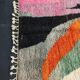 Large handmade Moroccan rug with colourful patterns.