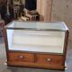 Shop counter display cabinet with old drawers, 1900s