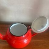 Red enamelled sheet metal teapot